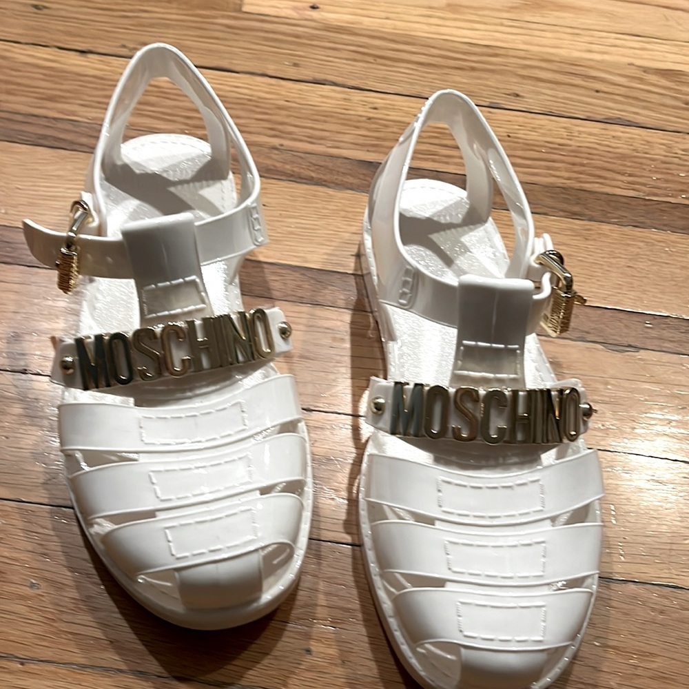 White Moschino gold logo hardware jelly size 37 (7). Like new used once.
